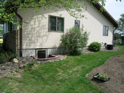 A ran house near a rain garden