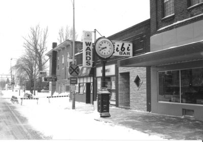 Historical buildings along the street with signs out front