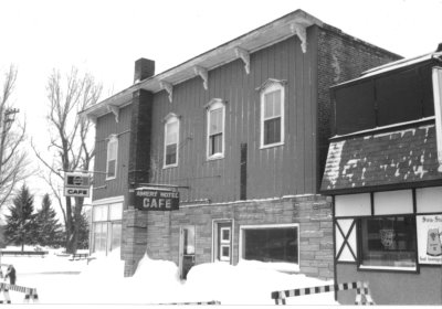 A black and white photo of an old cafe