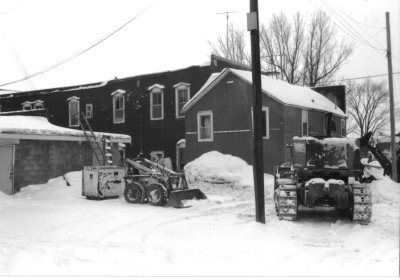 Tractors shoveling snow